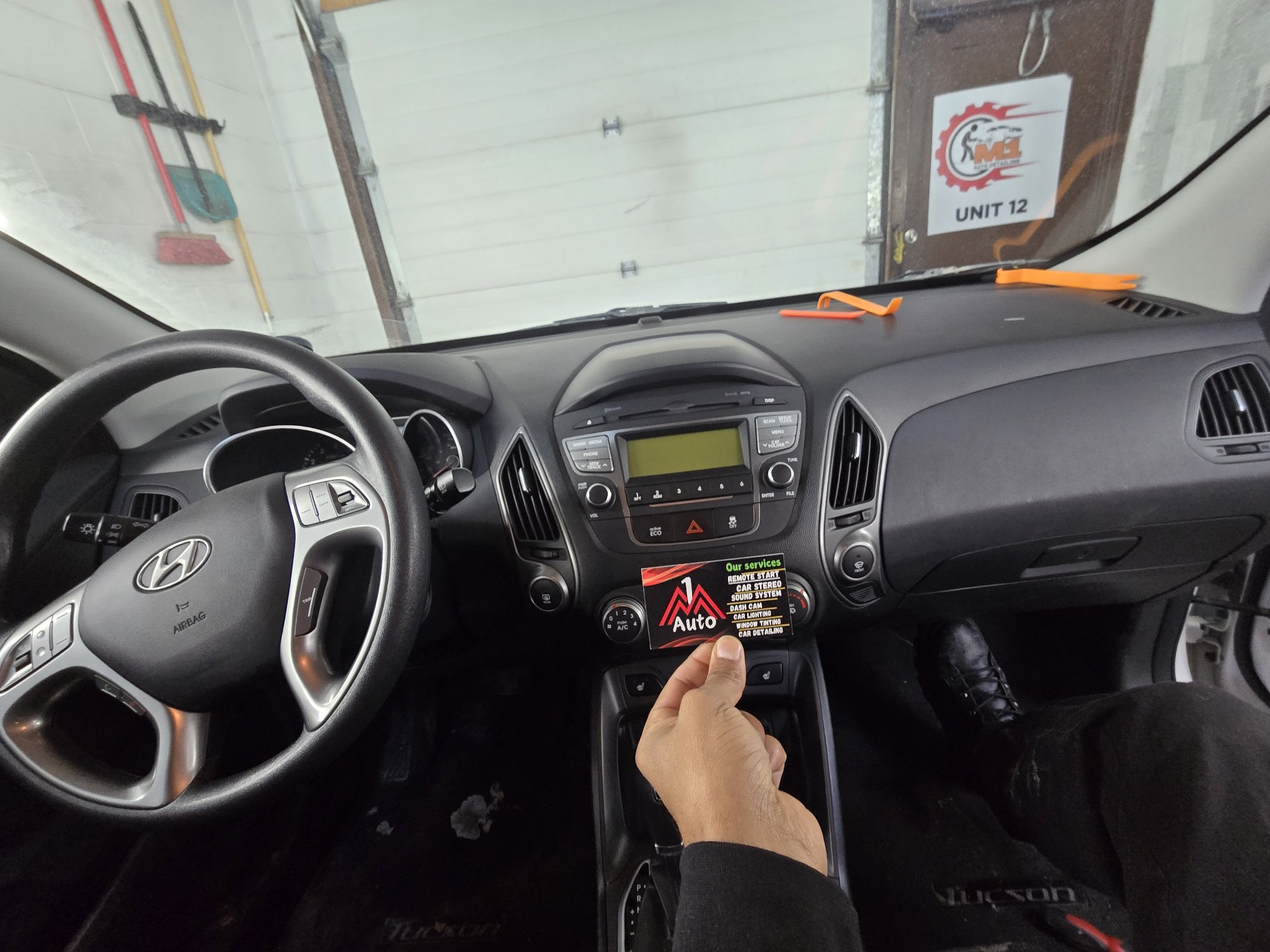 2014 Hyundai Tucson dashboard with the original stock radio
