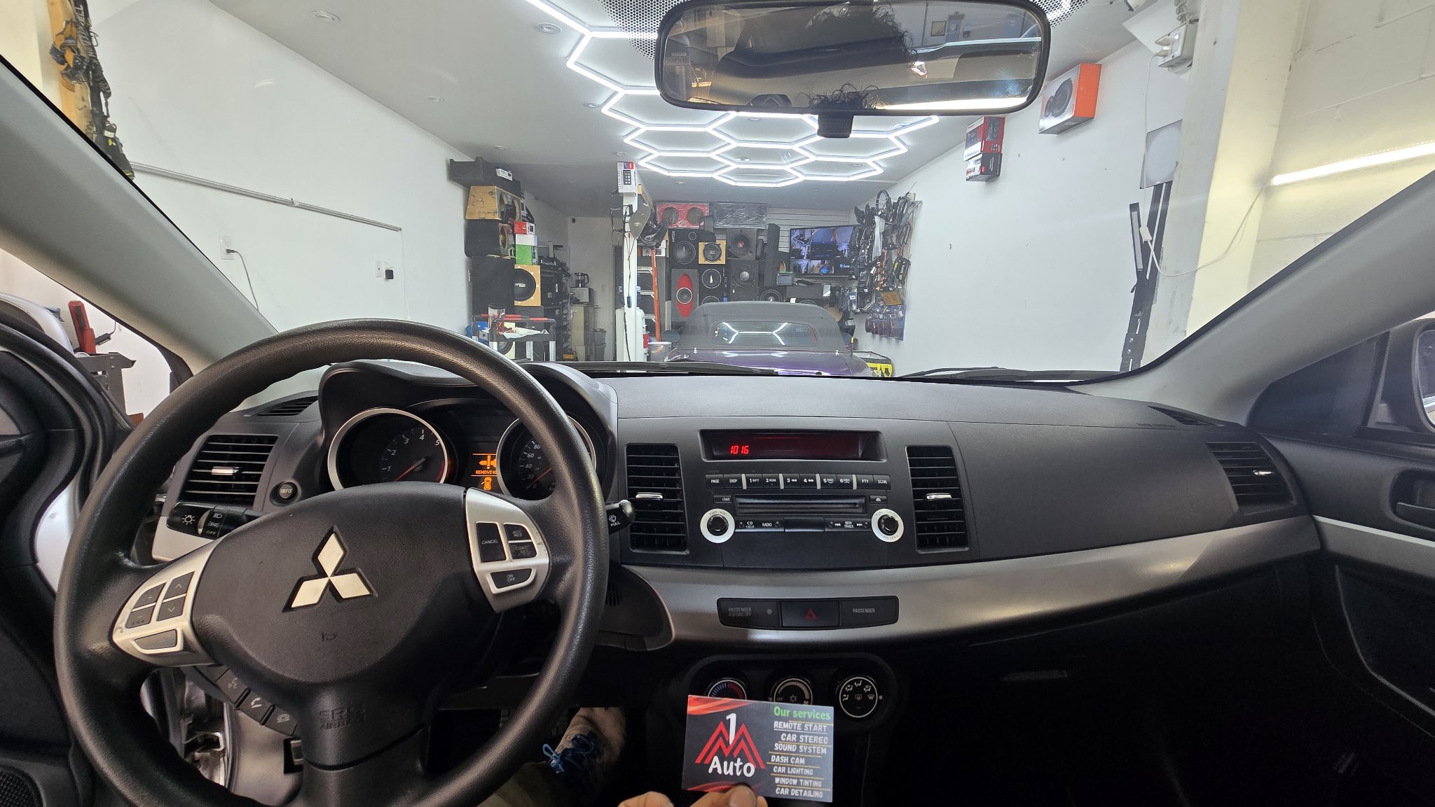 2010 Mitsubishi Lancer dashboard with the original stock radio