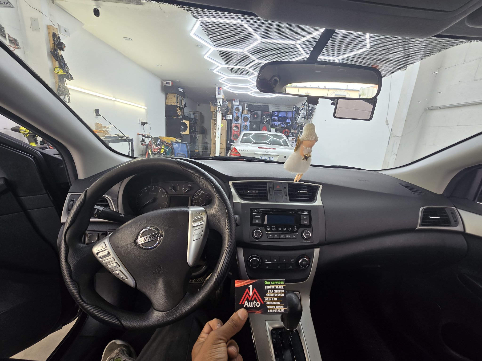 2015 Nissan Sentra dashboard with the original stock radio