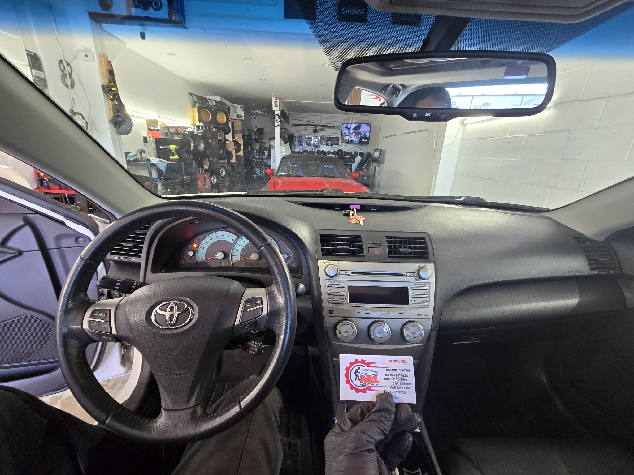 2010 Toyota Camry dashboard with the original stock radio