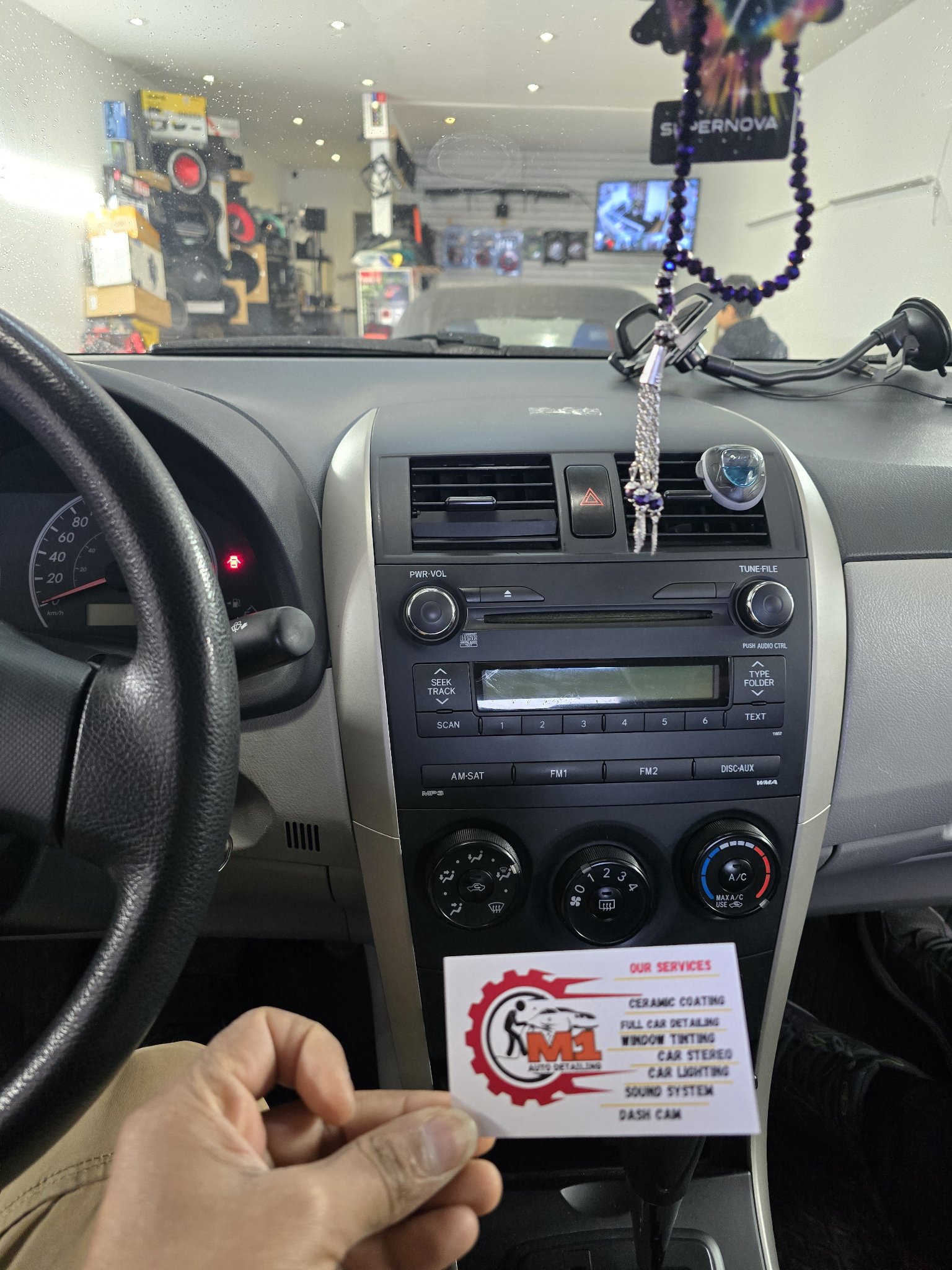 2012 Toyota Corolla dashboard with the original stock radio