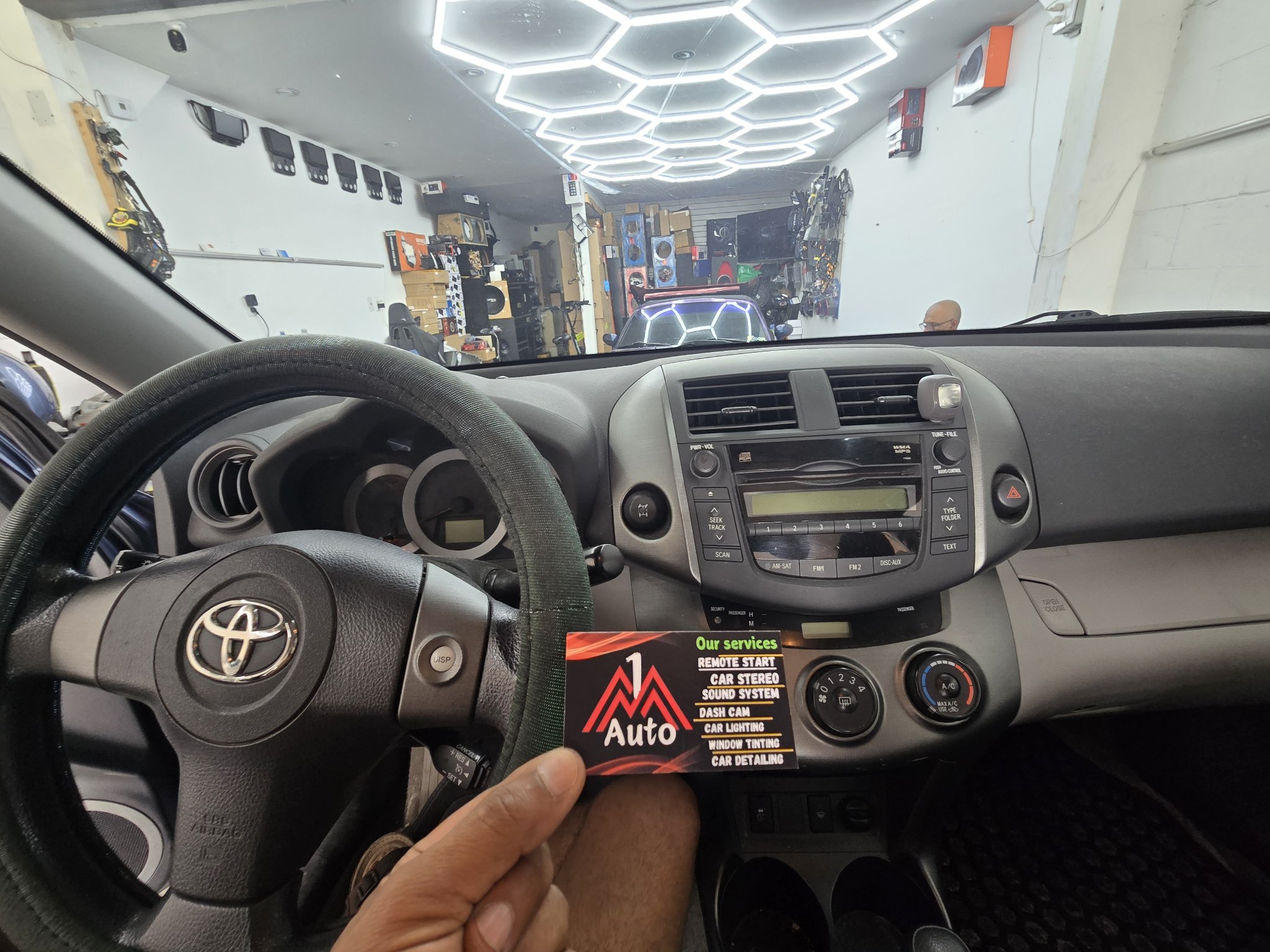 2011 Toyota RAV4 dashboard with the original stock radio
