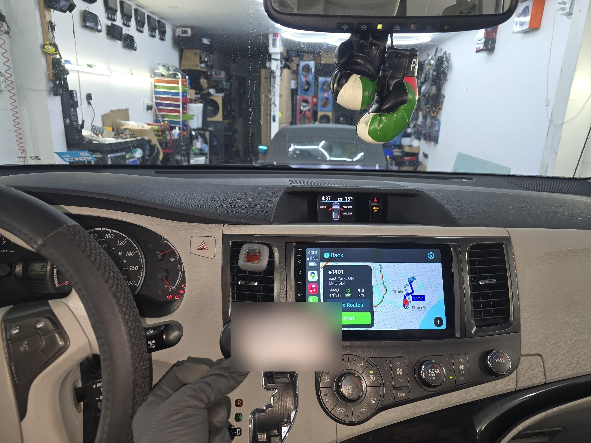2012 Toyota Sienna dashboard with a new touchscreen head unit showing CarPlay maps