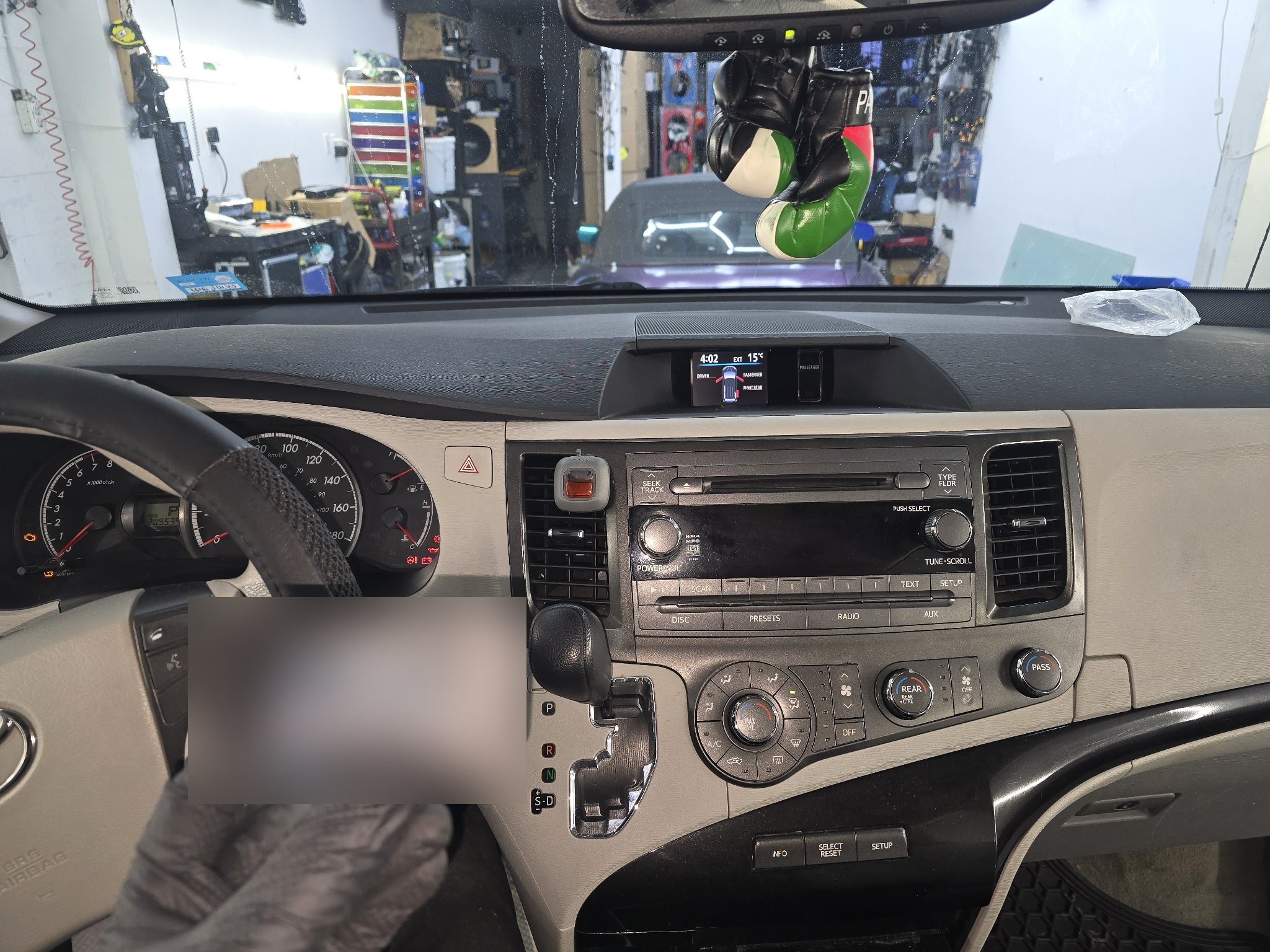 2012 Toyota Sienna dashboard with the original stock radio